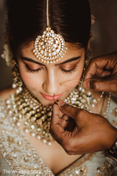 Indian bride getting her nose ring capture. Indian bride getting her nose ring capture.