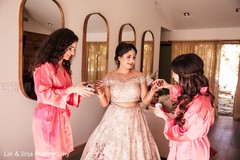 Maharani getting help to put on her chooras. Maharani getting help to put on her chooras.
