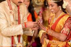 Maharani and Indian groom interchanging rings Maharani and Indian groom interchanging rings