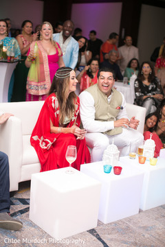 Joyful couple at sangeet celebration. Joyful couple at sangeet celebration.