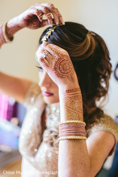 Lovely Indian bride putting her tikka on. Lovely Indian bride putting her tikka on.