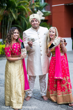 Indian groom negotiation with bridesmaids for his mojaris. Indian groom negotiation with bridesmaids for his mojaris.