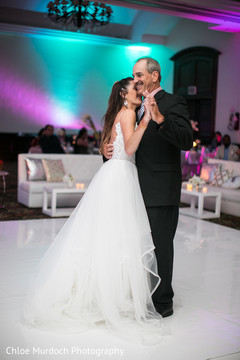 Cute indian bride dancing with her father. Cute indian bride dancing with her father.