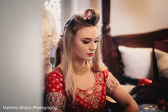 Beautiful indian bride being dolled up for her ceremony Beautiful indian bride being dolled up for her ceremony