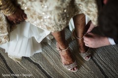 Indian groom helping the bride get ready. Indian groom helping the bride get ready.