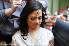 See this enchanting Indian bride getting her hair done. See this enchanting Indian bride getting her hair done.