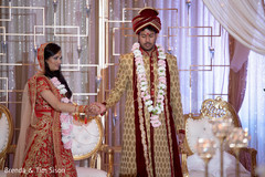 Indian bride and groom walking the seven steps around sacred fire. Indian bride and groom walking the seven steps around sacred fire.