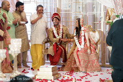 Indian groom holding Indian bride's hand at ceremony. Indian groom holding Indian bride's hand at ceremony.