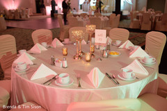 Elegant Indian wedding reception table setup. Elegant Indian wedding reception table setup.