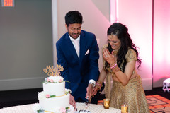 Indian wedding reception cutting the cake scene. Indian wedding reception cutting the cake scene.