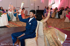 Indian couple capture ar traditional shoe game. Indian couple capture ar traditional shoe game.