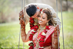 Indian bride and groom outdoors during pictures Indian bride and groom outdoors during pictures