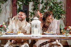 Indian bride and groom reacting to speeches Indian bride and groom reacting to speeches