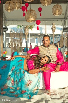 Indian bride and groom posing for pictures Indian bride and groom posing for pictures