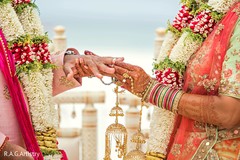 Bride placing the ring on Raja Bride placing the ring on Raja