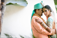 Cute indian bride and groom's first look capture. Cute indian bride and groom's first look capture.