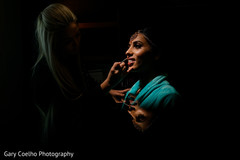 Lovely Indian bride getting her lipstick on. Lovely Indian bride getting her lipstick on.