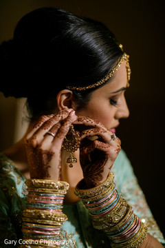 Incredible Indian bride putting her ceremony jewelry. Incredible Indian bride putting her ceremony jewelry.
