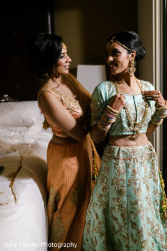 Indian bride getting her long golden necklace. Indian bride getting her long golden necklace.
