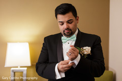 Indian groom getting his reception outfit. Indian groom getting his reception outfit.