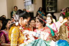 Indian bride getting a garland at her haldi rituals. Indian bride getting a garland at her haldi rituals.