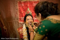 Indian bride getting the yellow turmeric paste on. Indian bride getting the yellow turmeric paste on.