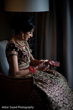 Lovely Indian bride putting her chooras. Lovely Indian bride putting her chooras.