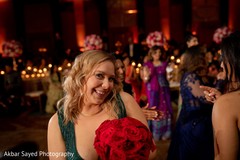 Sweet Indian wedding guest with bouquet capture. Sweet Indian wedding guest with bouquet capture.