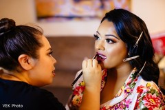 Lovely bride getting her makeup done Lovely bride getting her makeup done