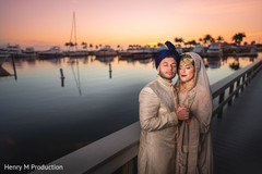 Indian bride and groom posing during sunset Indian bride and groom posing during sunset