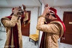 Indian groom putting turban on. Indian groom putting turban on.