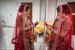Enchanting Indian bride putting her kalires on. Enchanting Indian bride putting her kalires on.