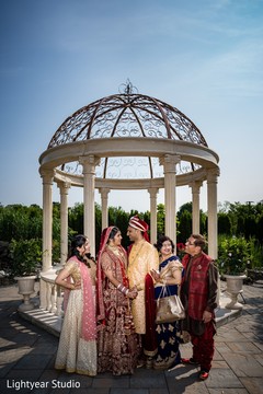 Indian couple posing with relatives capture. Indian couple posing with relatives capture.