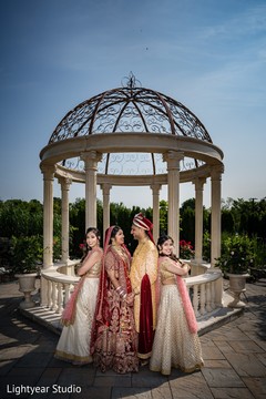 Indian bridesmaids posing with lovely indian couple. Indian bridesmaids posing with lovely indian couple.