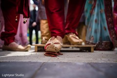 Indian groom's closeup capture of foot at milni ritual. Indian groom's closeup capture of foot at milni ritual.