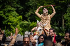 Elegant Indian groom riding baraat white horse. Elegant Indian groom riding baraat white horse.