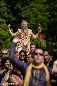 Indian groom riding baraat white horse. Indian groom riding baraat white horse.
