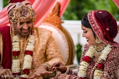 Indian bride putting ring to groom. Indian bride putting ring to groom.