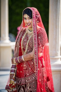 Dreamy Indian bride on her ceremony outfit. Dreamy Indian bride on her ceremony outfit.