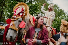 Groom riding a majestic white horse. Groom riding a majestic white horse.