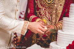 Indian bride and groom cutting the cake Indian bride and groom cutting the cake