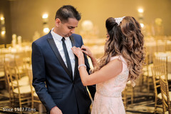 Bride assisting the groom Bride assisting the groom