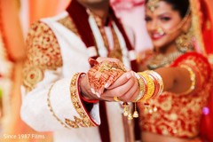 Indian bride and groom holding hands Indian bride and groom holding hands