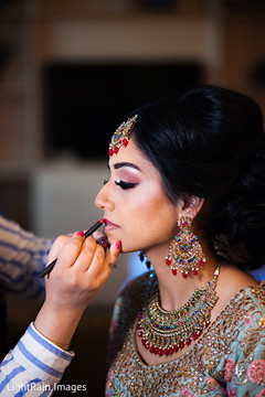 Lovely bride getting her makeup done Lovely bride getting her makeup done