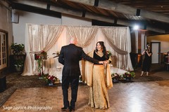 Indian bride and groom magical first dance scene. Indian bride and groom magical first dance scene.