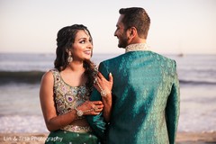 Indian bride and groom looking at each other Indian bride and groom looking at each other