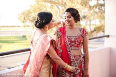 Maharani being assisted by family Maharani being assisted by family