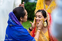 Ritual of painting the bride with yellow turmeric paste Ritual of painting the bride with yellow turmeric paste