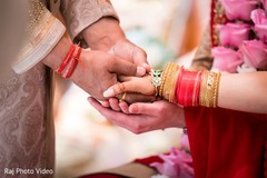 Indian bride and groom holding hands Indian bride and groom holding hands
