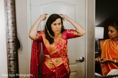 Indian bride putting the jewelry on Indian bride putting the jewelry on